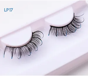 Macro shot of D-curl black false eyelashes with blue glitter tips in white tray