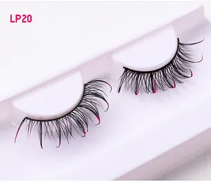 Detail of Russian D-curl false eyelashes with pink glitter tips in a white storage tray