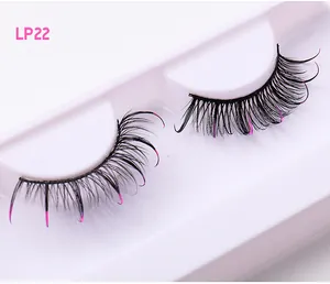 Close-up of D-curl Russian false eyelashes with pink glitter tips in white packaging