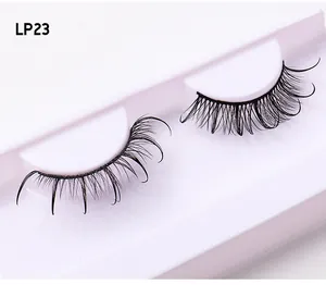 Detail of Russian D curl false eyelashes with glitter accent on white display tray