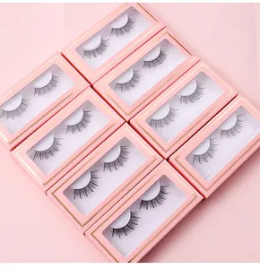 Flat lay of pink glitter eyelash boxes showing Russian D-curl synthetic false lashes