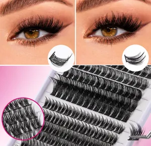 Detail of D-curl individual eyelash clusters being applied with tweezers for a thick look