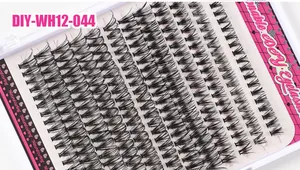 Detailed macro view of natural DIY individual lash clusters in a white plastic storage tray