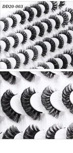Macro detail of 20 pairs high-volume Russian curl false eyelashes on white tray