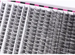 Macro detail of high-capacity false eyelash clusters organized on a checkered display tray