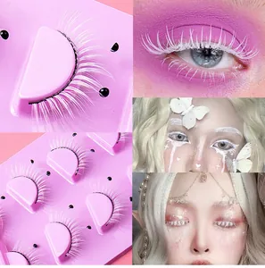 Detailed view of long white artistic false eyelashes with pearls for stage makeup