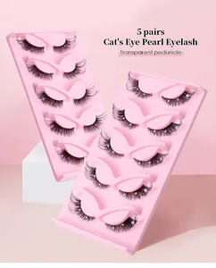 Detailed view of 5 pairs of fox-eye false eyelashes with pearls on transparent bands