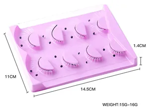 Detail shot of 7 pairs of light pink feathered false eyelashes in a storage tray