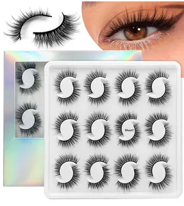 Detail view of 12 pairs of multi-layered natural false eyelashes in a laser gift box