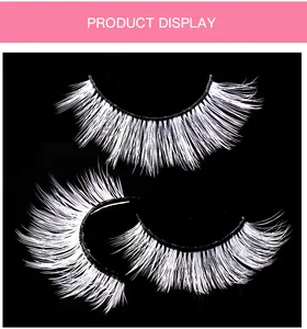 Macro detail of dramatic long white false eyelashes for stage makeup and creative styling