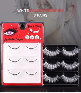 Detailed view of 3 pairs of white false eyelashes for cosplay and stage makeup