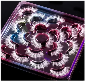 Macro view of long thick white synthetic false eyelashes in a purple display case