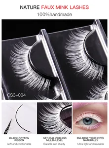 Macro shot of 3D layered white faux mink lashes with flexible black cotton band for stage makeup