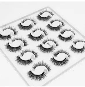 Macro shot of 12 pairs of dense multi-layer false eyelashes in a tray labeled Short1