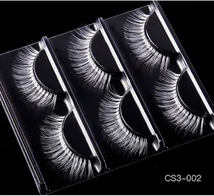 Macro shot of 5 pairs of thick white synthetic eyelashes for stage makeup and cosplay