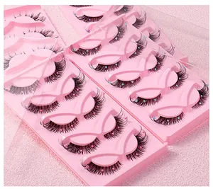 Detailed view of fox-style false eyelashes with multi-colored pearls on pink trays