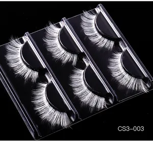 Detailed view of 5 pairs of white cosplay false eyelashes for stage makeup in a black case