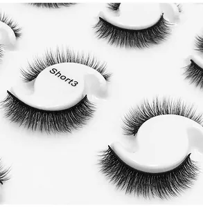 Detailed macro view of Short3 natural dense false eyelashes in a white designer tray