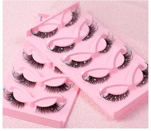 Macro detail of 5 pairs of fox-eye false eyelashes with colorful pearl accents on clear bands