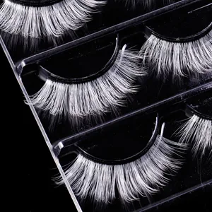 Three pairs of dense white synthetic fiber false eyelashes for stage and festival makeup
