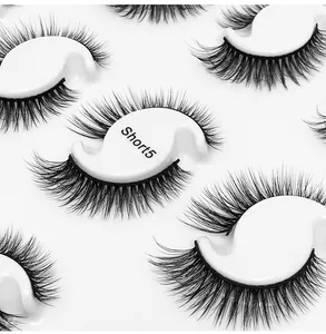 Macro shot of Short5 layered synthetic false eyelashes on a white S-shaped tray