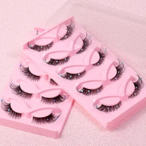 Two boxes of fox-eye false eyelashes with colorful pearl accents on pink trays