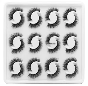 Detail of 12 pairs of dense black synthetic fiber false eyelashes in a 4x3 grid tray