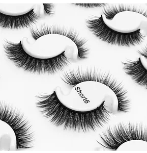 Macro detail of Short 6 multilayered thick synthetic eyelashes on white S-shape holders