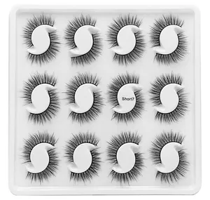 Detail showing twelve pairs of dense black synthetic eyelashes in a Short7 model case