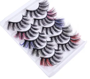 Close-up of 5 pairs of thick, curly faux mink eyelashes with colorful fiber accents