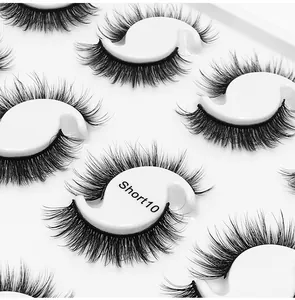 Close-up of Short10 multi-layer thick false eyelashes on white S-shaped display card