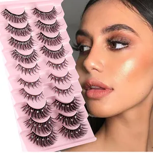 Detailed view of 10 pairs of thick false eyelashes with silver glitter and rhinestones