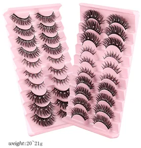 Detail of 10 pairs thick fiber eyelashes with colorful rhinestones in pink trays
