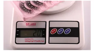 Detailed weight measurement showing 20g for rhinestone eyelashes in pink packaging