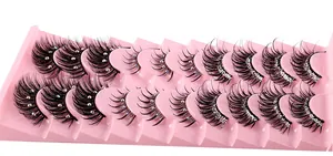 Detailed view of 10 pairs of dense false eyelashes with rhinestones in a pink tray