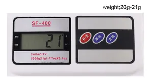 Close-up of SF-400 digital kitchen scale LCD panel and control buttons on white plastic body