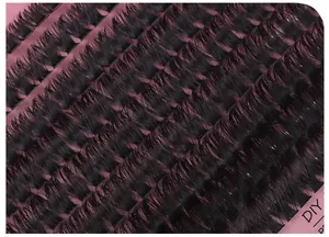 Macro shot of 80D-150D matte black cluster eyelashes on a pink DIY backing card