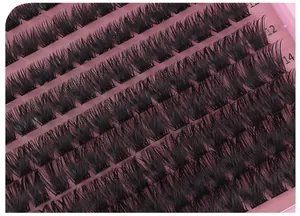 Macro detail of individual lash clusters in 12mm and 14mm lengths on pink tray