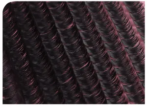 Detailed close-up of 80D-150D dense black cluster eyelash extensions on silk background