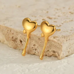 Polished 18K gold plated lava heart drop earrings with a sleek mirror finish on stone base