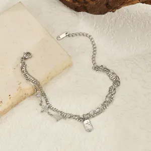 Double-layered silver star charm bracelet in stainless steel with engraved rectangle tag