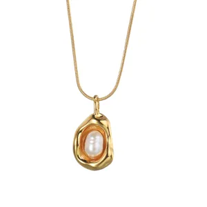 French vintage 18K gold plated necklace featuring a lava-textured pearl pea pendant