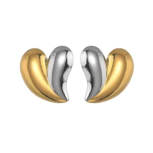 Two-tone heart-shaped 18K gold and silver stainless steel studs in asymmetrical design