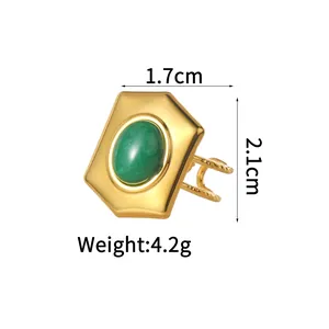 Detail of 18K gold-plated geometric ring with green stone and retro wave texture