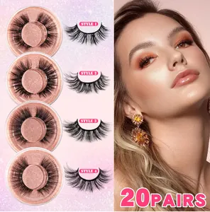 Détail de 20 paires de faux cils longs et épais dans des boîtes roses à paillettes