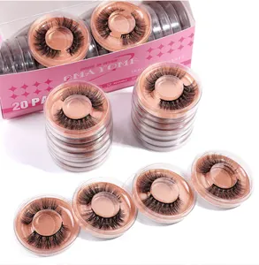 Détail macro de 20 paires de faux cils 3D denses dans des boîtes roses avec base pailletée