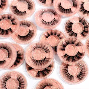 Macro di ciglia finte 3D folte e nere in una custodia tonda con glitter rosa