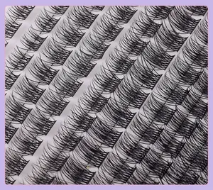 Detailed macro view of individual C-curl false eyelash clusters with natural cross-texture