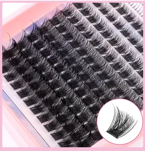 Macro view showing natural C-curl individual lash clusters on a pink display tray