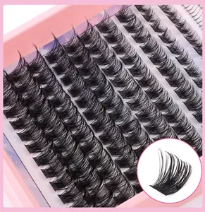 Macro detail of natural voluminous multi-layered cluster eyelashes in pink storage tray